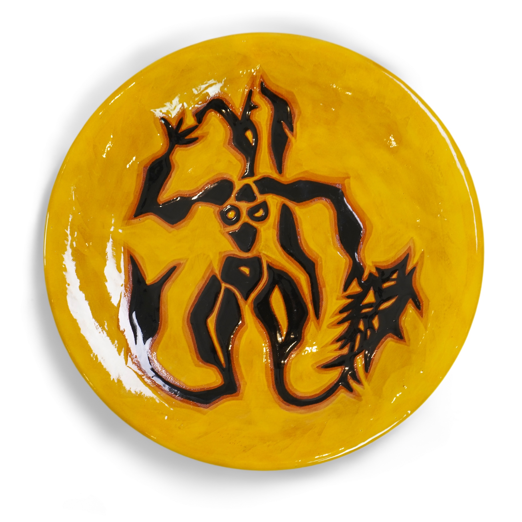 Jean Lurçat (1892-1966): A yellow glazed earthenware plate, decorated with a stylised central figure
